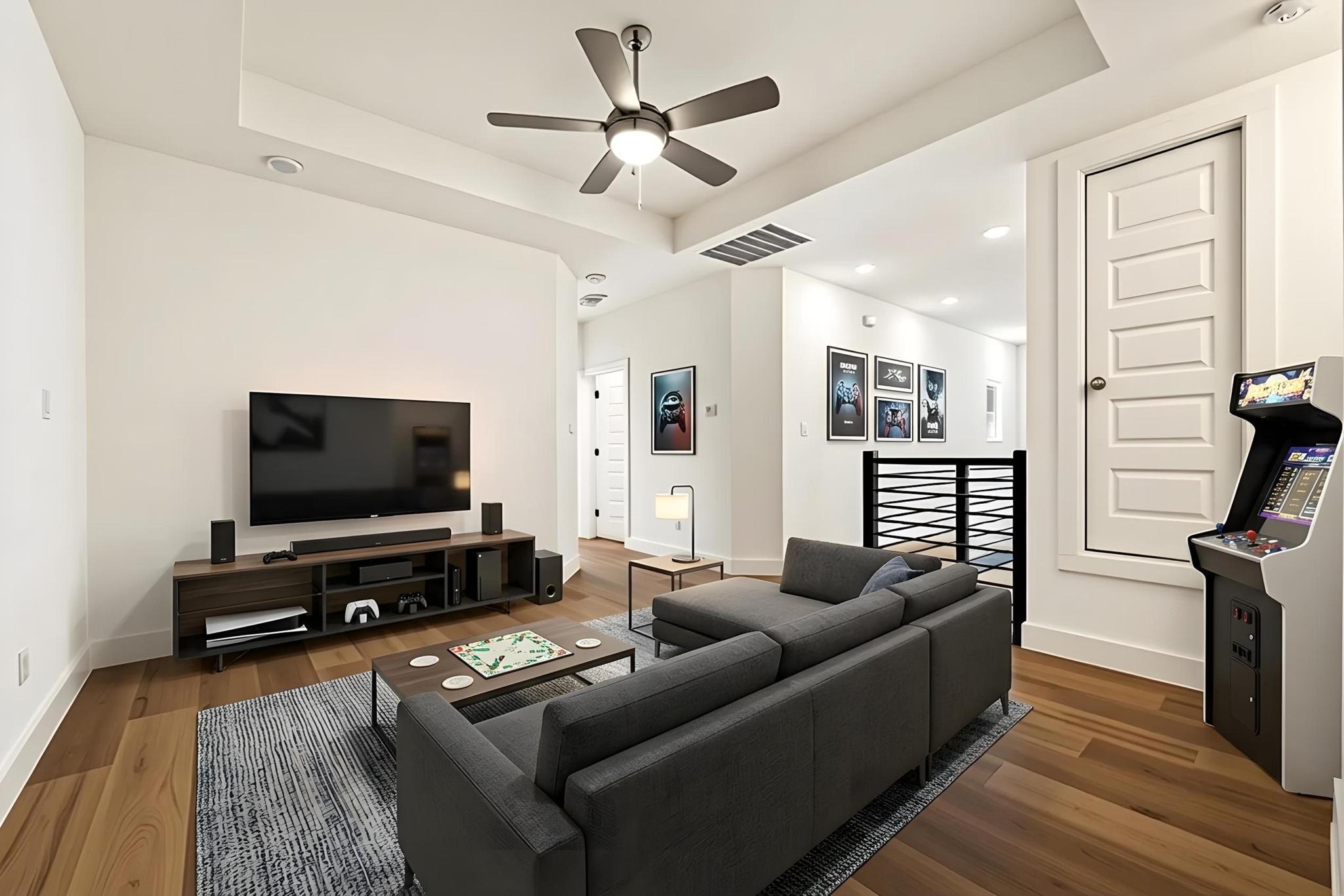 306 Cartwheel Bend, Unit 130 Austin, TX 78738 - Photo 10 of 40 a living room with furniture and a flat screen tv