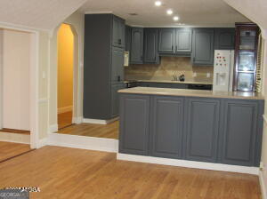 6662 Goodall Mill Road Macon, GA 31216 - Photo 16 of 50 a kitchen with a refrigerator and a sink