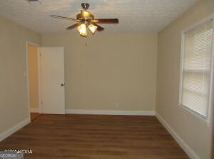 6662 Goodall Mill Road Macon, GA 31216 - Photo 28 of 50 a view of a room with wooden floor and a window