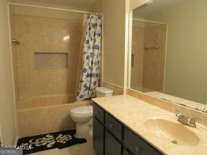 6662 Goodall Mill Road Macon, GA 31216 - Photo 35 of 50 a bathroom with a sink and a mirror