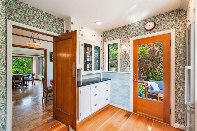a view of kitchen with furniture and large window