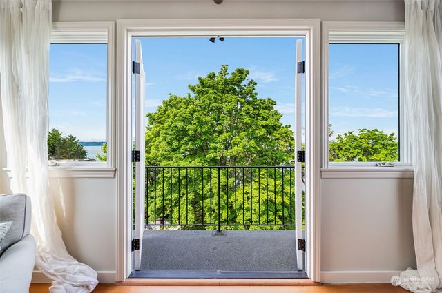 a view of a porch with potted plants