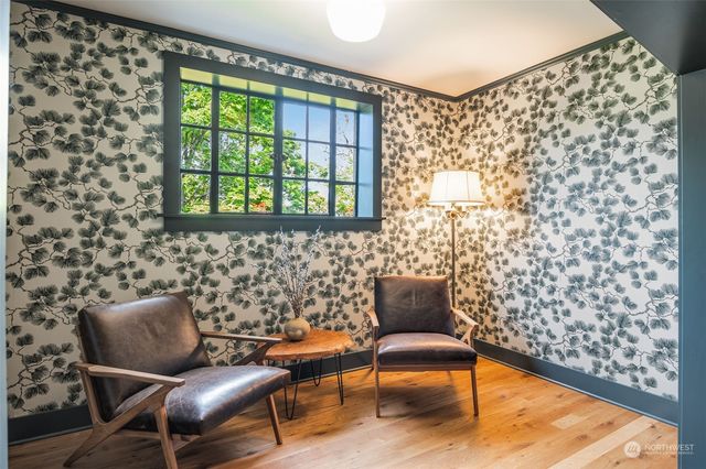 a blue chair sitting in front of a window
