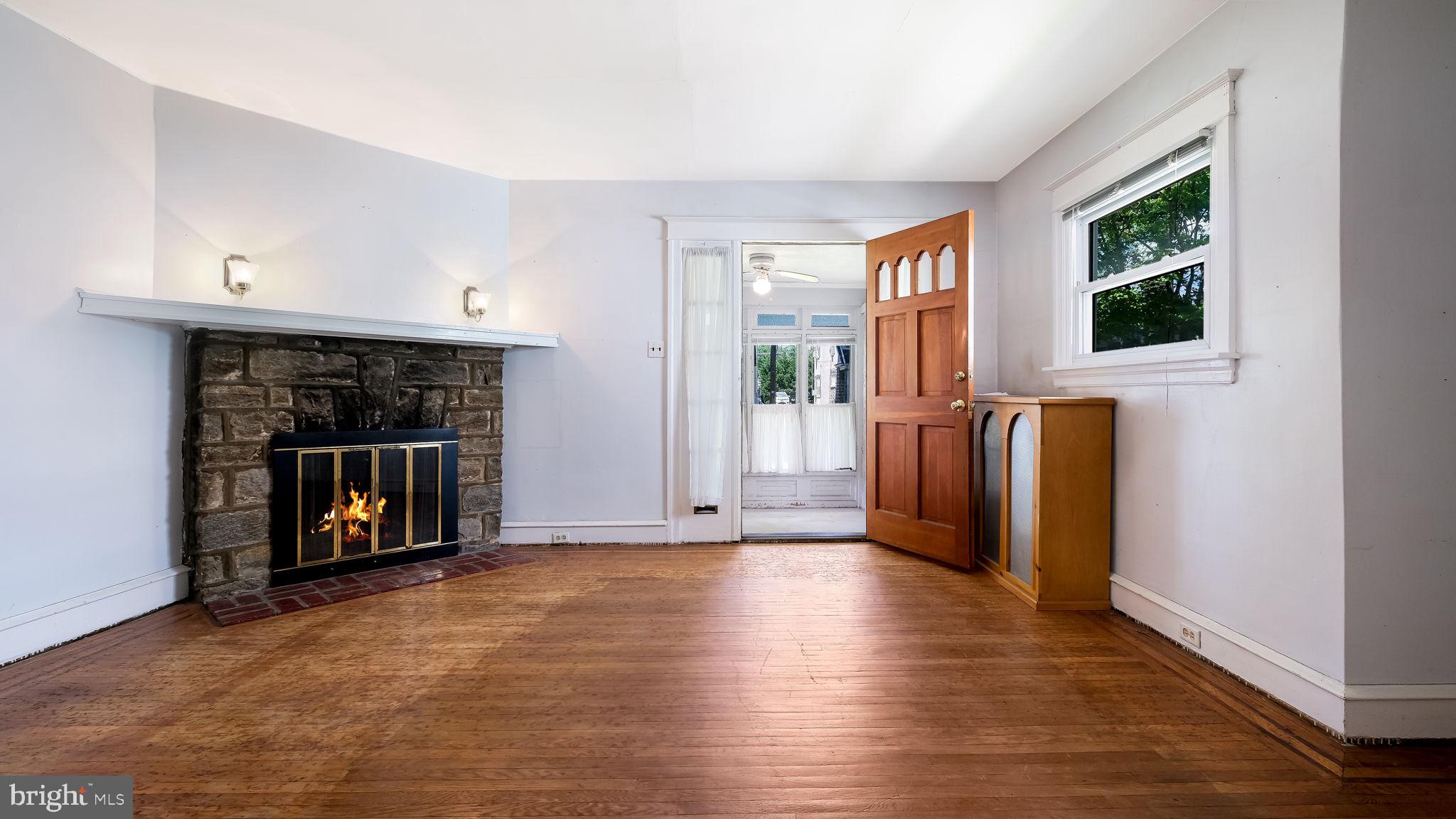 271 Ballymore Road Springfield, PA 19064 - Photo 5 of 21 a view of an empty room with window and fire place