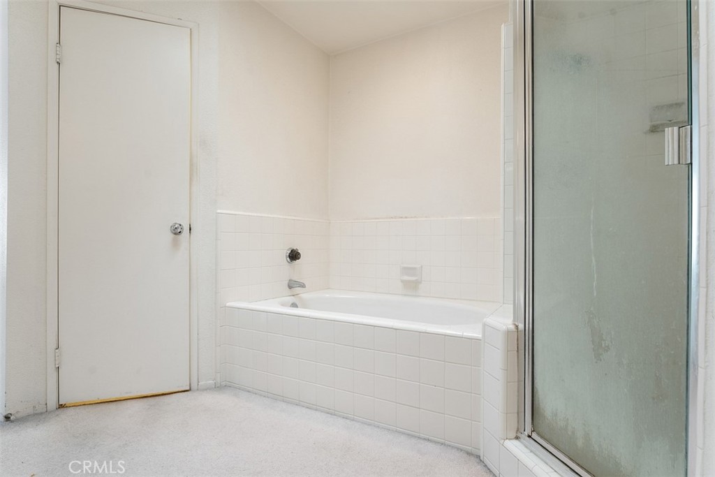 7040 Marino Place Rancho Cucamonga, CA 91701 - Photo 23 of 45 a bathroom with a bathtub and a sink