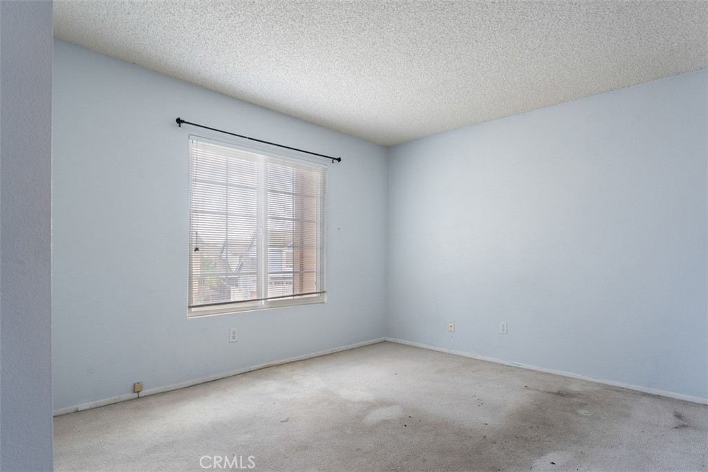 7040 Marino Place Rancho Cucamonga, CA 91701 - Photo 27 of 45 an empty room with a window