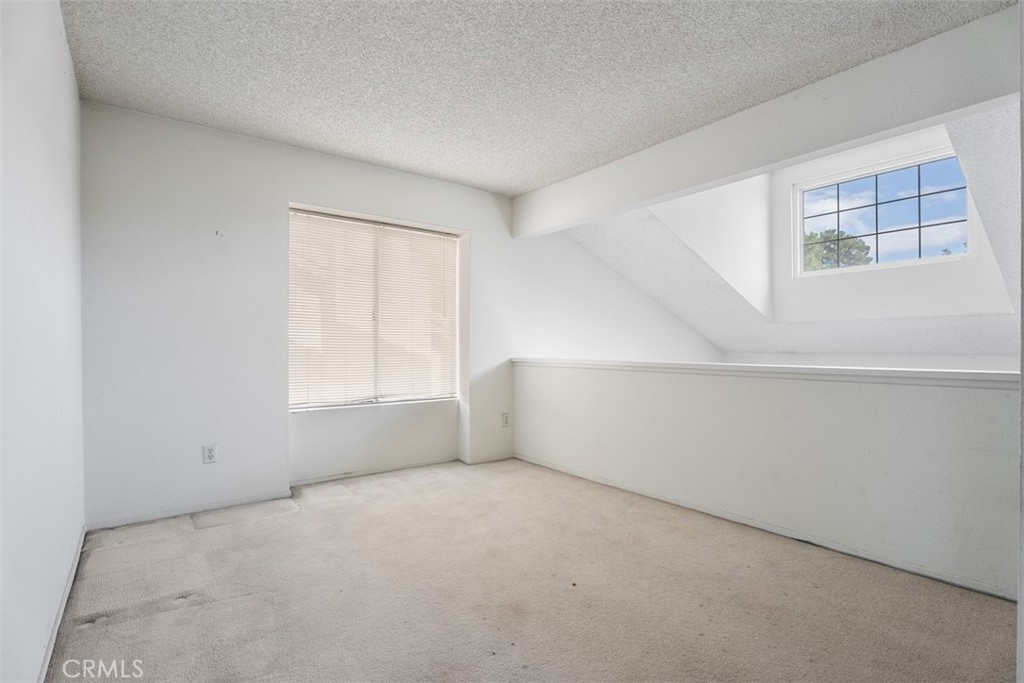 7040 Marino Place Rancho Cucamonga, CA 91701 - Photo 28 of 45 a view of an empty room with a window