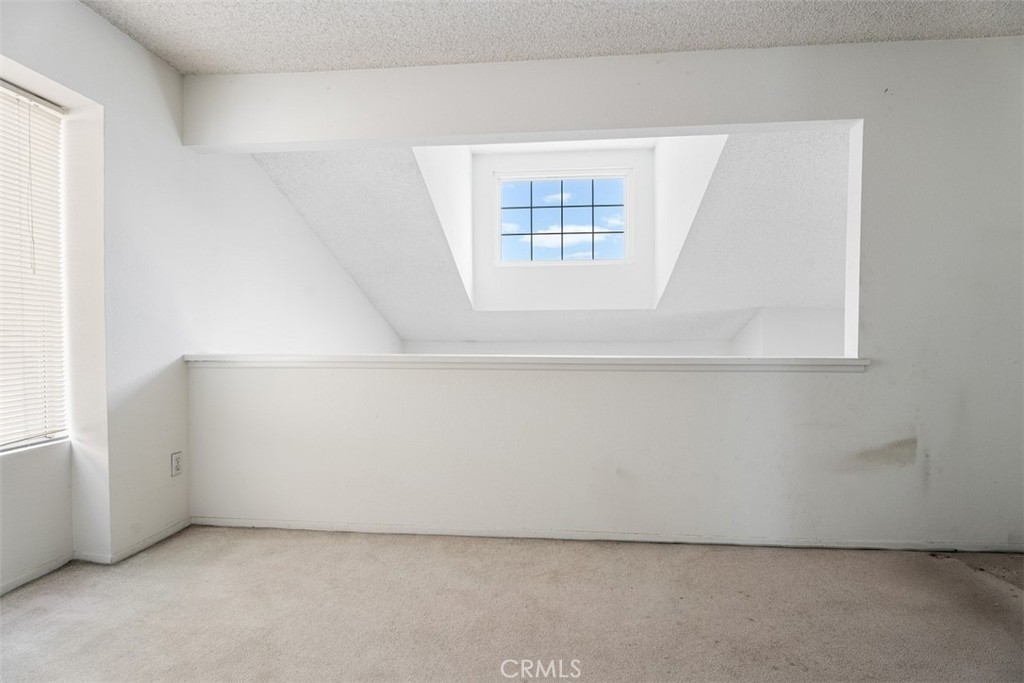 7040 Marino Place Rancho Cucamonga, CA 91701 - Photo 29 of 45 an empty room with windows
