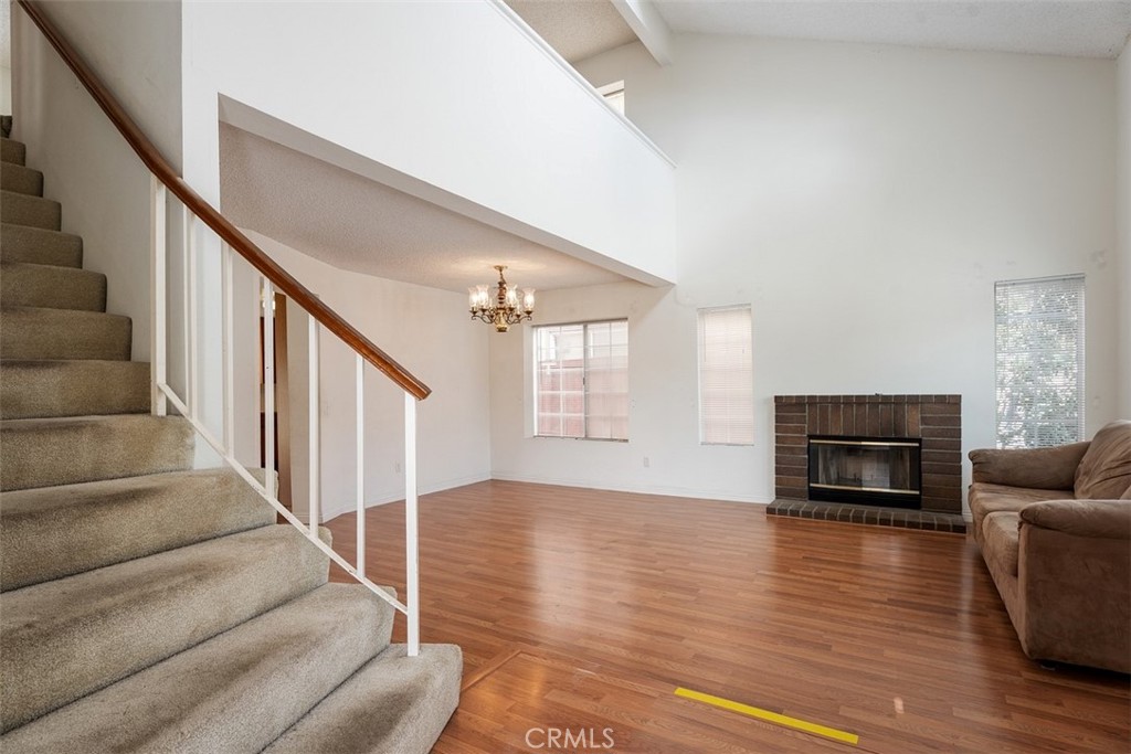 7040 Marino Place Rancho Cucamonga, CA 91701 - Photo 9 of 45 a living room with furniture fireplace and wooden floor