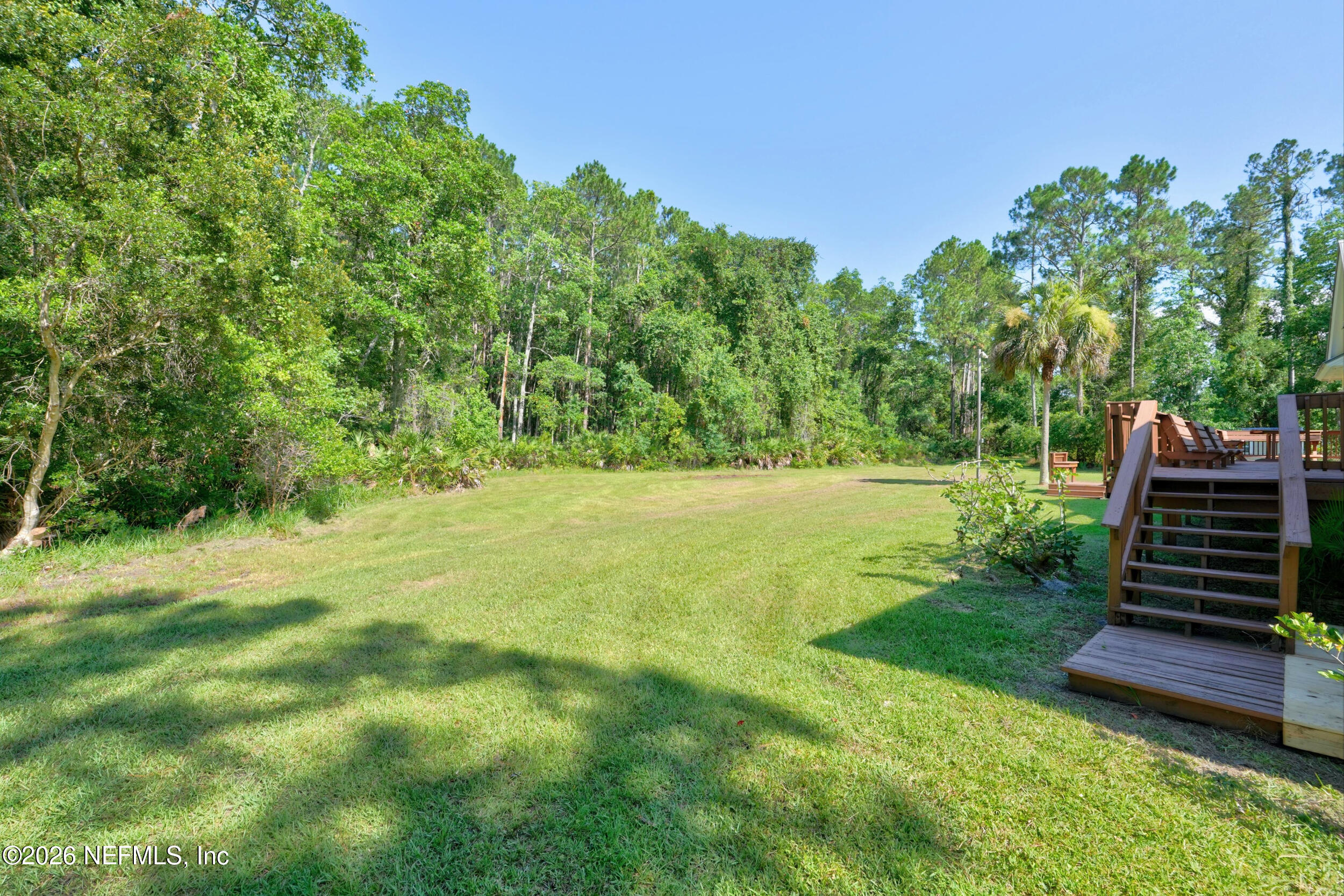 3090 Monument Bay Road St. Augustine, FL 32092 - Photo 45 of 56 a view of outdoor space with deck and yard