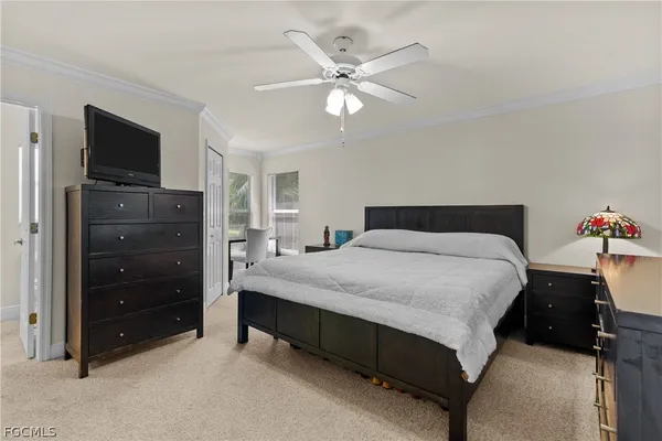 a bedroom with a bed and a tv