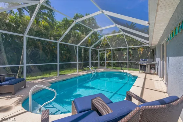 a view of a chairs and table in the patio