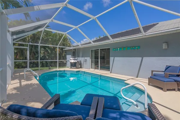 a view of a room with wooden floor windows and chairs