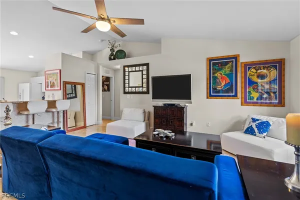 a living room with furniture and a flat screen tv
