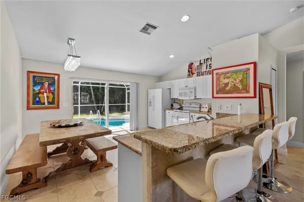 a view of a dining room with furniture window and outside view