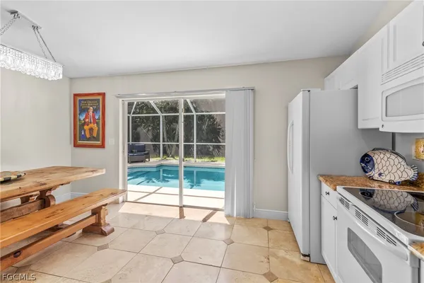 a kitchen with stainless steel appliances granite countertop a stove and a sink