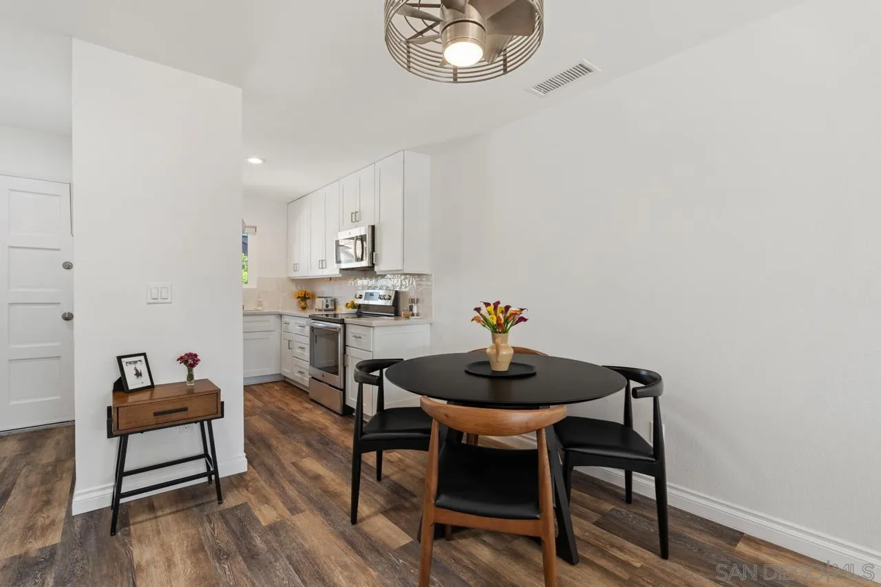 1628 Forestdale Drive Encinitas, CA 92024 - Photo 13 of 39 a view of a dining room with furniture and wooden floor