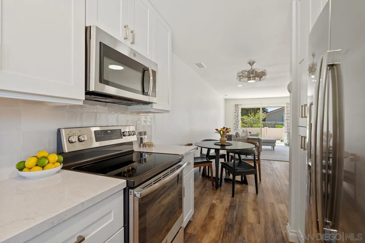 1628 Forestdale Drive Encinitas, CA 92024 - Photo 17 of 39 a kitchen with a stove and a microwave
