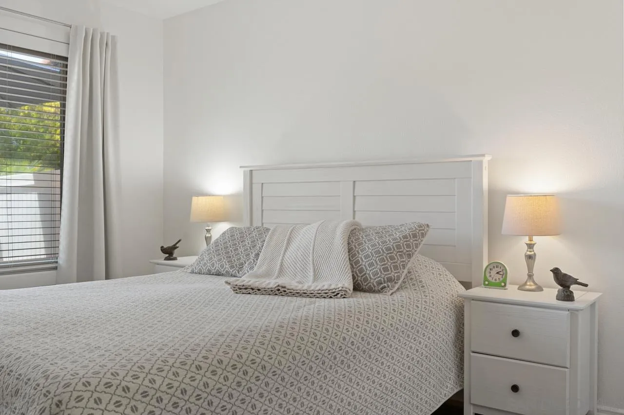 1628 Forestdale Drive Encinitas, CA 92024 - Photo 19 of 39 a bedroom with a bed and a window