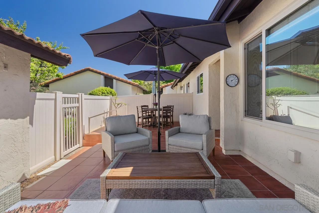 1628 Forestdale Drive Encinitas, CA 92024 - Photo 2 of 39 a view of a patio with table and chairs under an umbrella