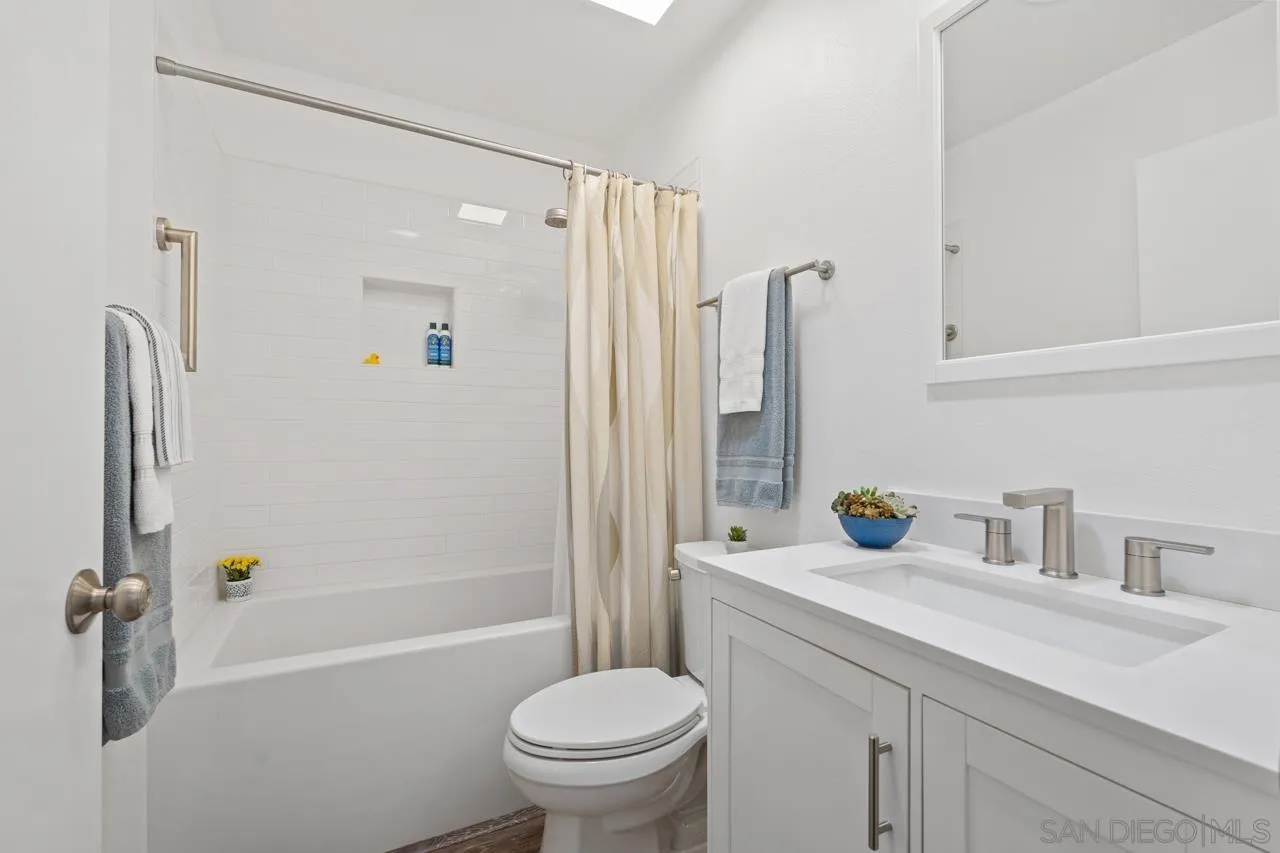 1628 Forestdale Drive Encinitas, CA 92024 - Photo 21 of 39 a bathroom with a sink a toilet and shower
