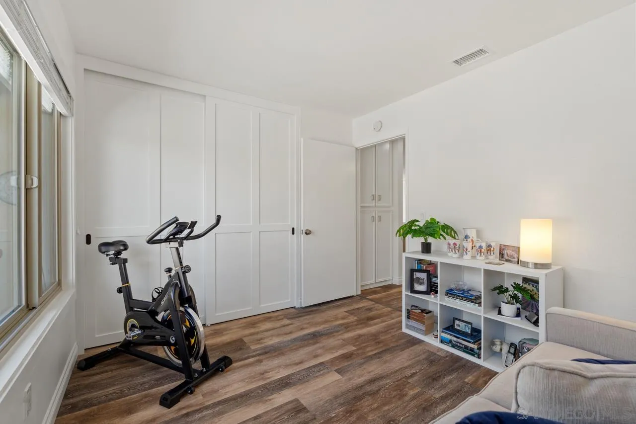 1628 Forestdale Drive Encinitas, CA 92024 - Photo 23 of 39 a view of a workspace with furniture and wooden floor
