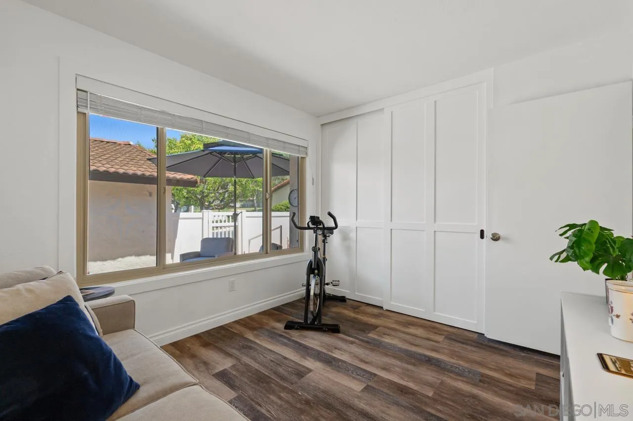 1628 Forestdale Drive Encinitas, CA 92024 - Photo 24 of 39 a view of a room with wooden floor and a potted plant
