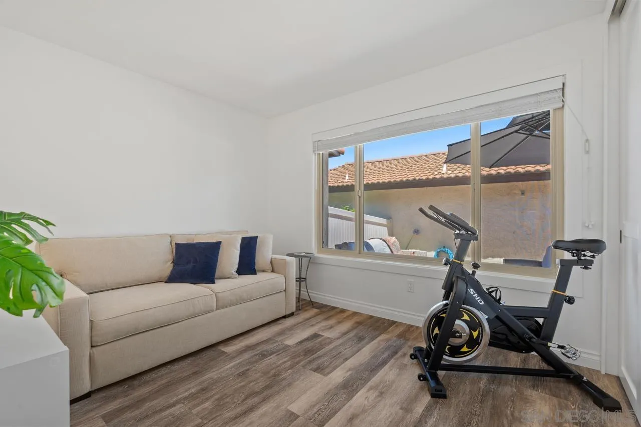 1628 Forestdale Drive Encinitas, CA 92024 - Photo 25 of 39 a living room with furniture and a wooden floor