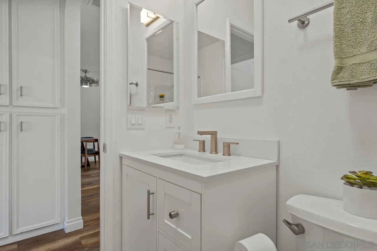 1628 Forestdale Drive Encinitas, CA 92024 - Photo 26 of 39 a bathroom with a sink toilet vanity and tub