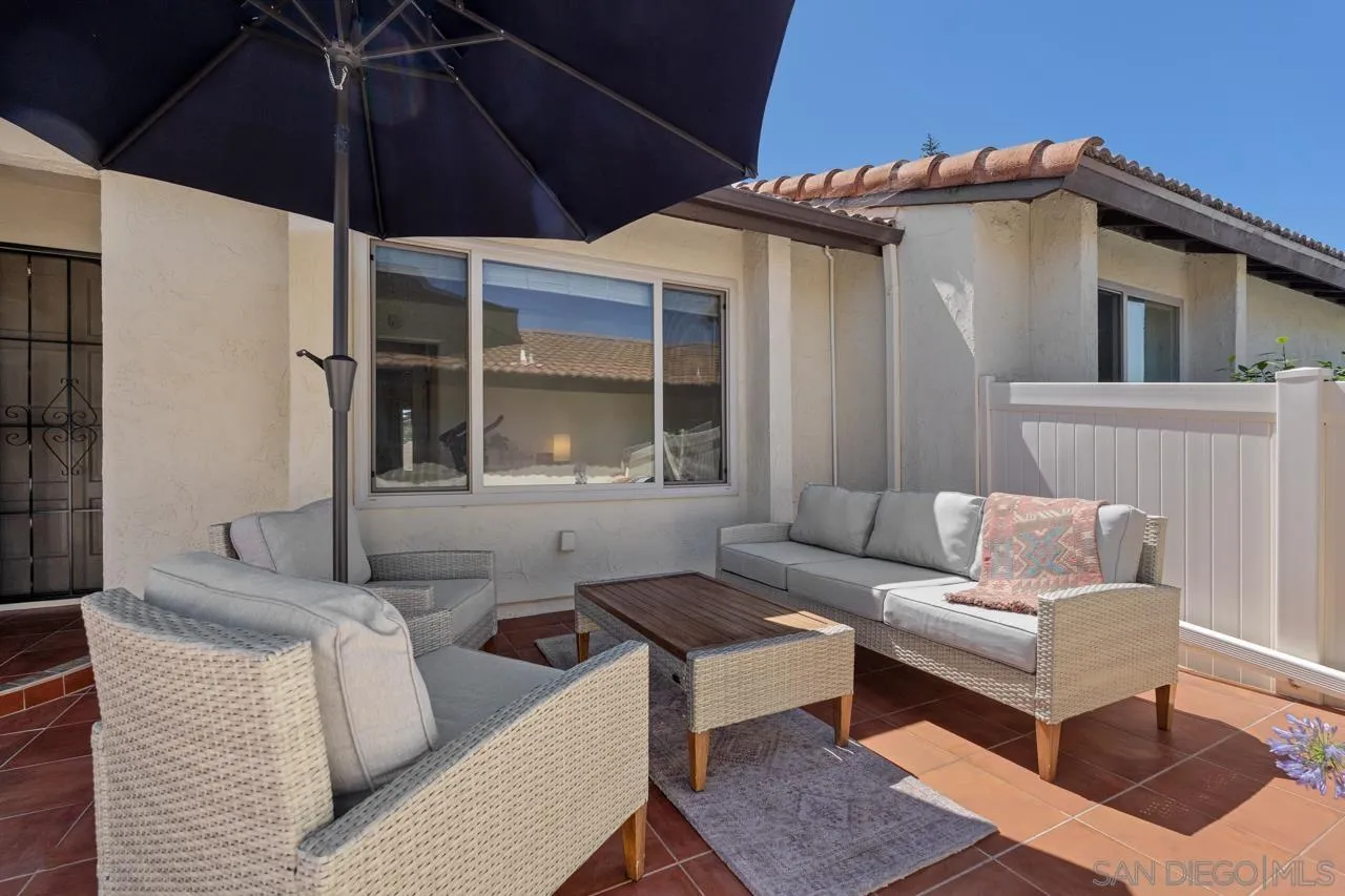1628 Forestdale Drive Encinitas, CA 92024 - Photo 5 of 39 a view of a patio with couches and a umbrella