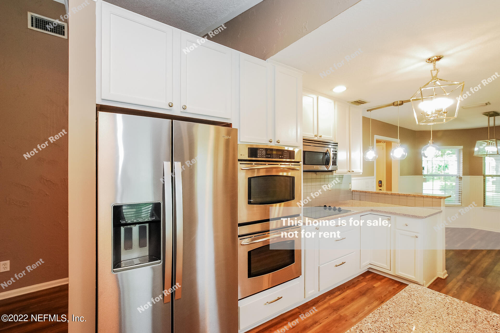 1760 Keswick Road St. Augustine, FL 32084 - Photo 11 of 27 a kitchen with stainless steel appliances a refrigerator sink and stove