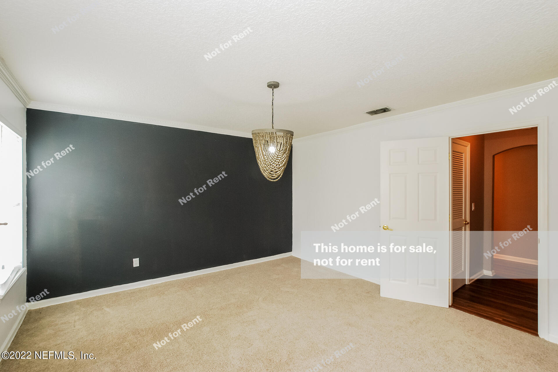 1760 Keswick Road St. Augustine, FL 32084 - Photo 15 of 27 a view of an empty room with wooden floor and cabinets