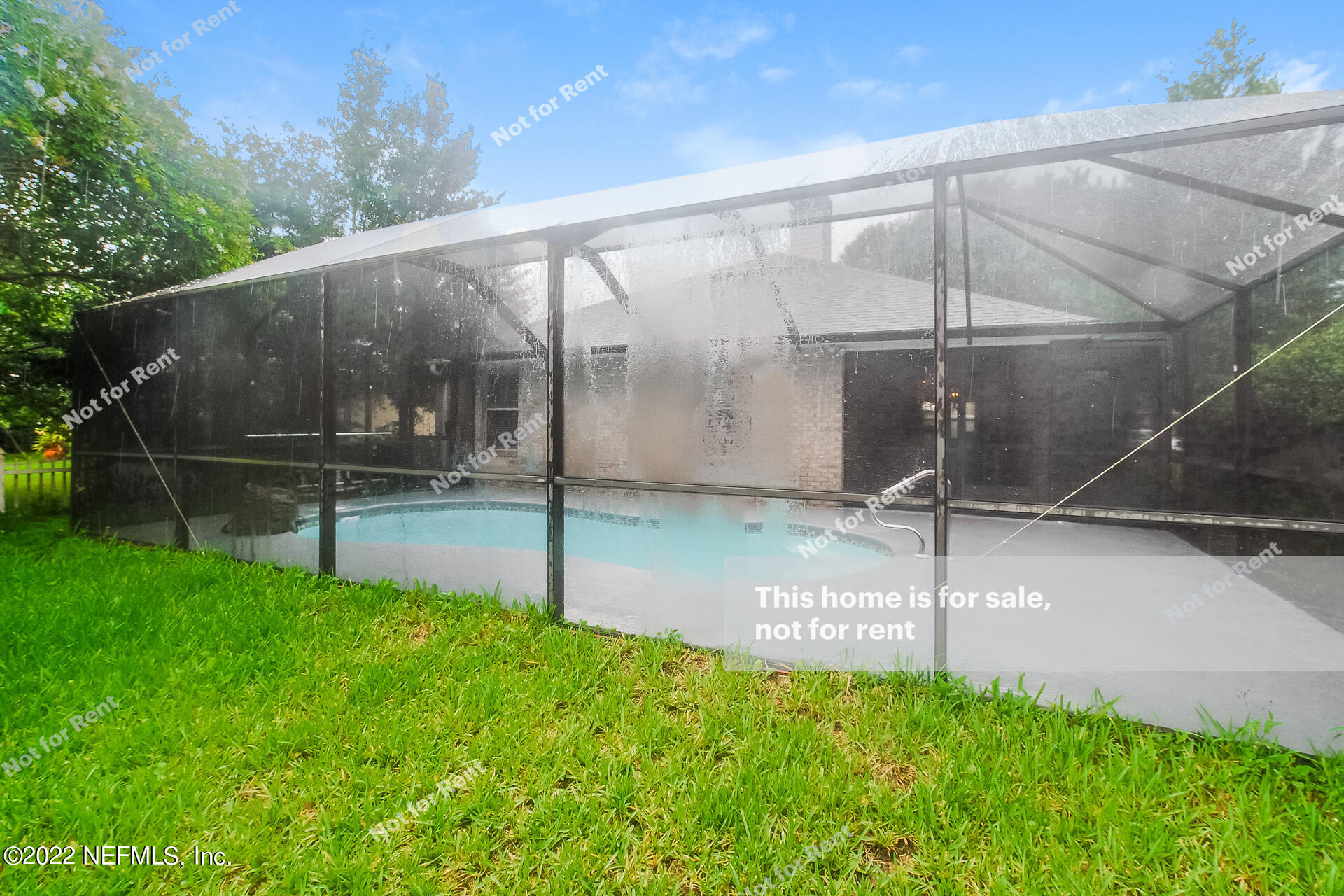 1760 Keswick Road St. Augustine, FL 32084 - Photo 25 of 27 a backyard of a house with a table and chairs