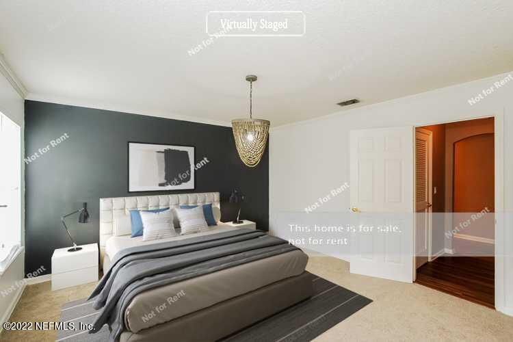 1760 Keswick Road St. Augustine, FL 32084 - Photo 3 of 27 a bedroom with bed and wooden floor