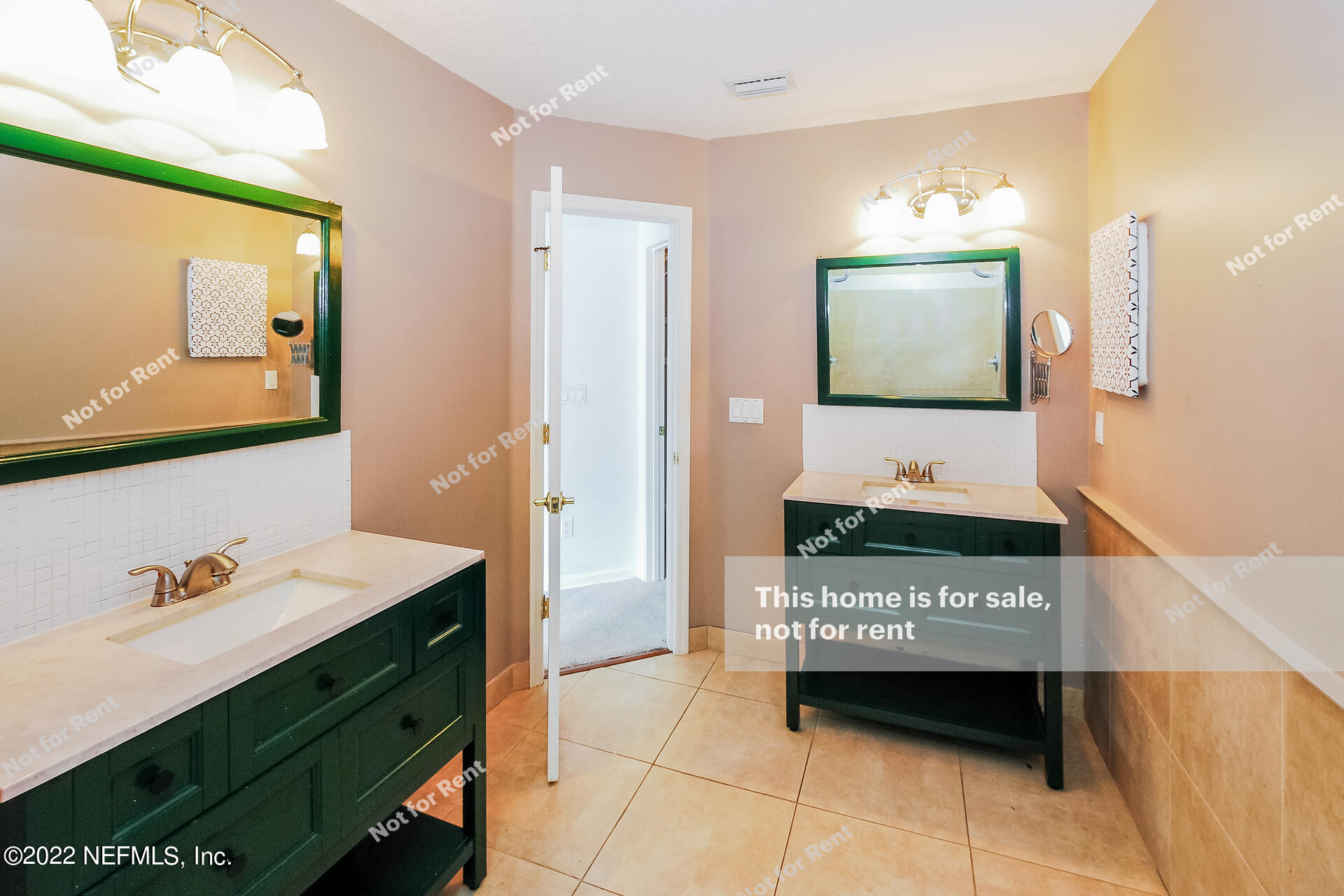1760 Keswick Road St. Augustine, FL 32084 - Photo 6 of 27 a bathroom with a sink a mirror and a toilet