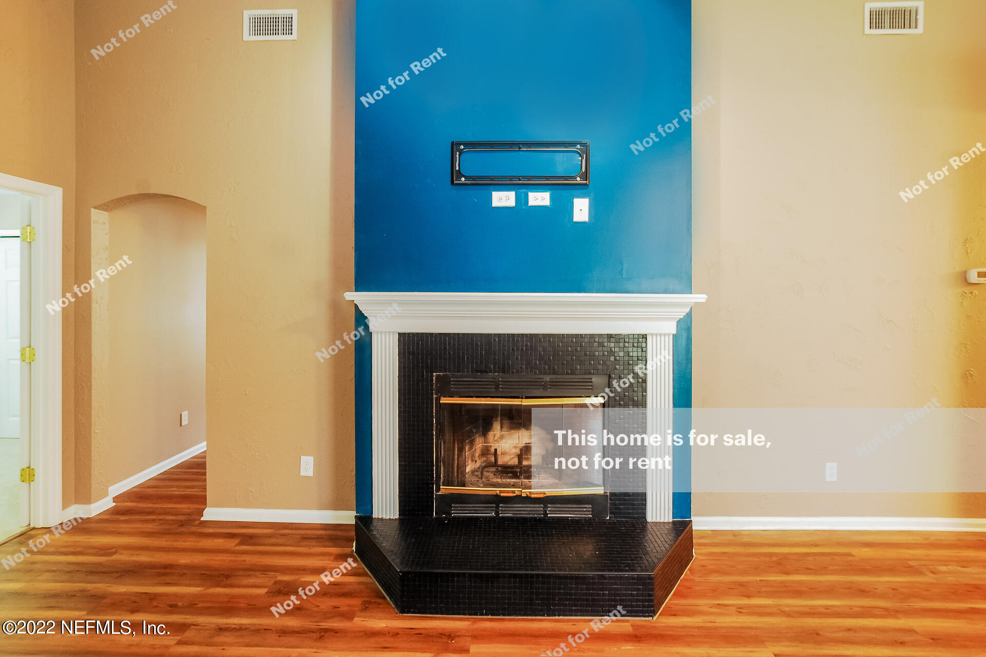 1760 Keswick Road St. Augustine, FL 32084 - Photo 9 of 27 a view of an empty room with wooden floor and a fireplace