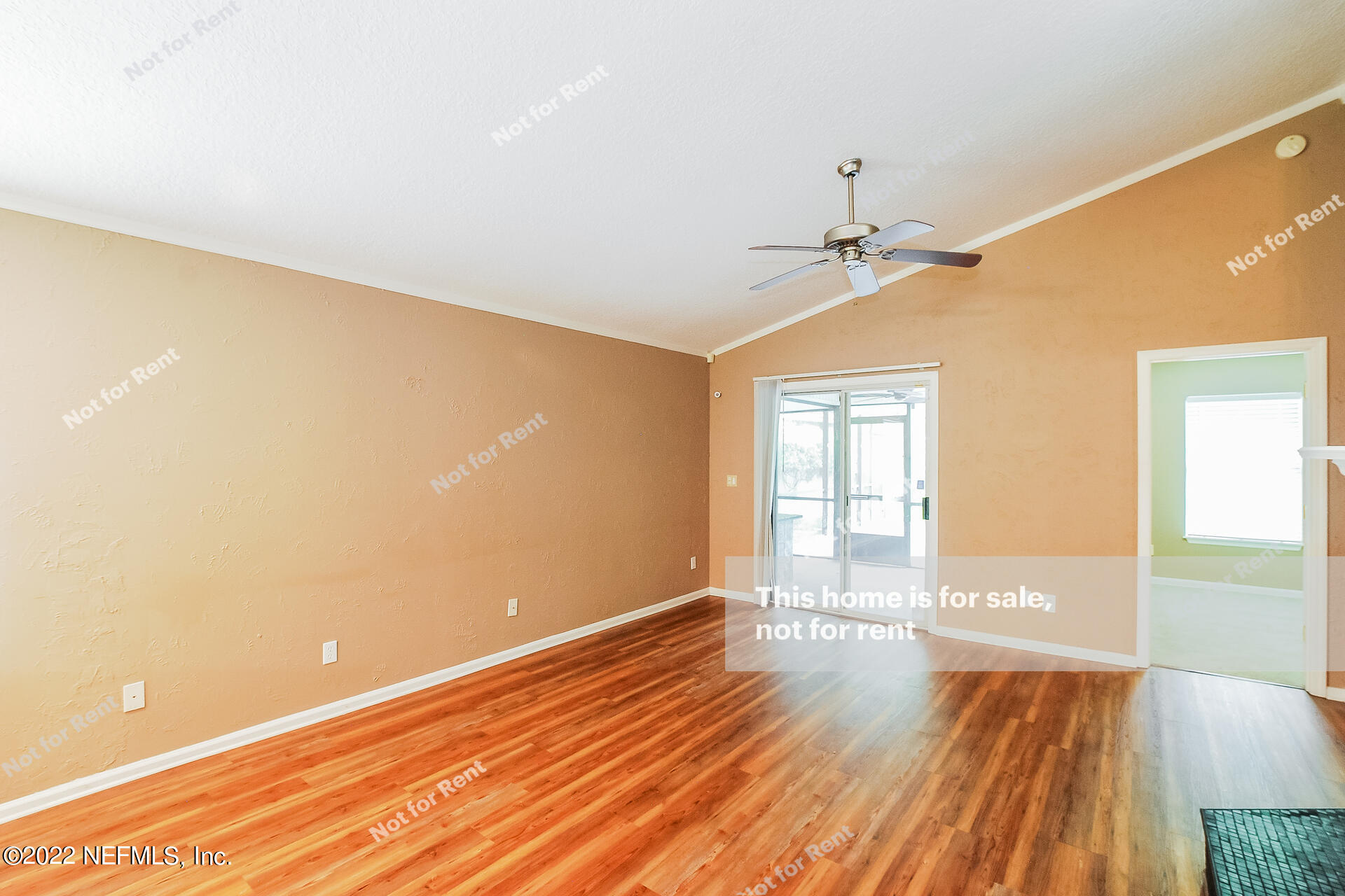 1760 Keswick Road St. Augustine, FL 32084 - Photo 10 of 27 a view of an empty room with wooden floor and a window