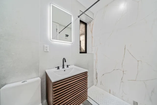 a utility room with sink dryer and washer