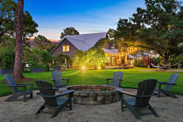 a view of a table and chairs in the garden