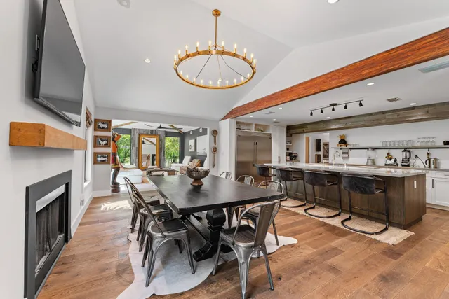 a living room with furniture and a ceiling fan