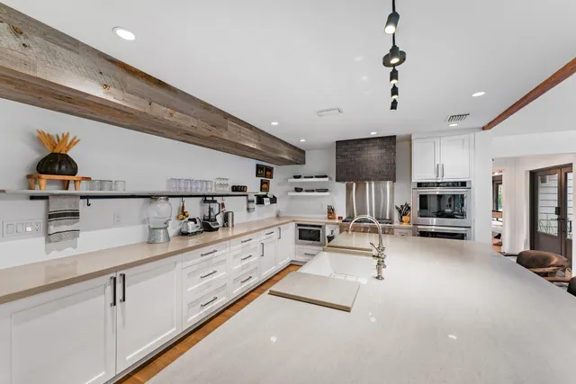 a living room with a couch and a large window