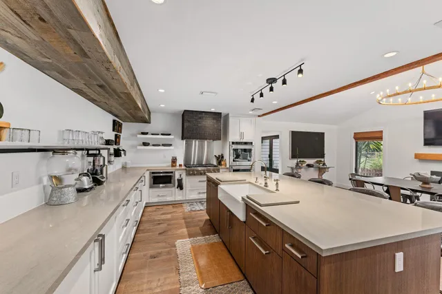 a bed room with a bed and a large window