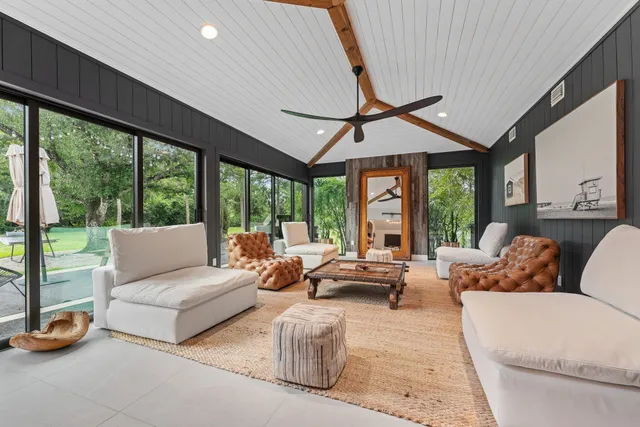 a living room with a couch and a walk in closet