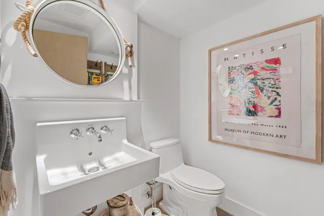 a spacious bedroom with a bed and a flat screen tv