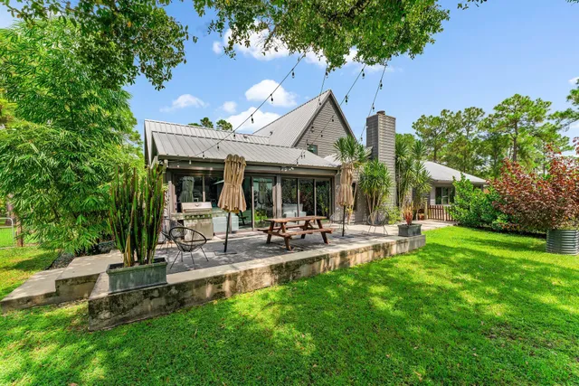 a view of an house with backyard space and garden