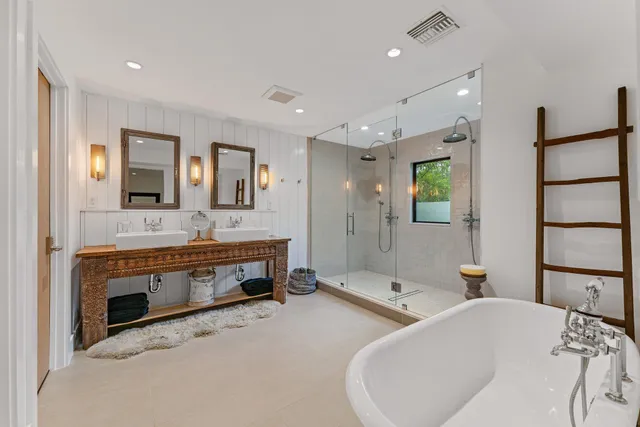 a view of a house with patio and a yard