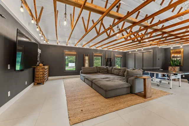 a view of a backyard with swimming pool