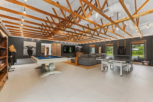 a view of a backyard with sitting area furniture and garden