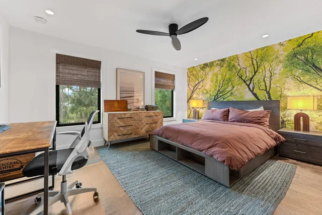 a front view of a house with a garden and plants