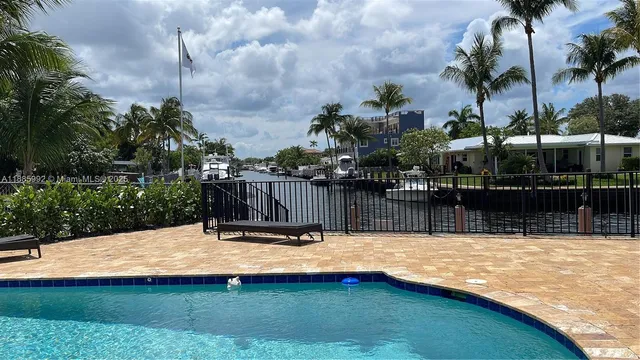 a swimming pool with wooden fence